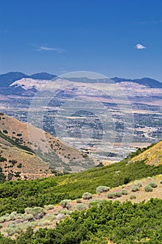 Panoramic Landscape view of Wasatch Front Rocky and Oquirrh Mountains, Rio Tinto Bingham Copper Mine, Great Salt Lake Valley in su photo