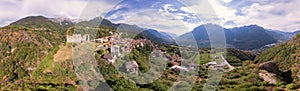 Panoramic landscape of a village and old ruins located next to a cliff