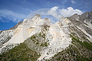 Panoramic landscape of white marble quarries of Carrara in the Apuan Alps. Colonnata, Massa Carrara district. Tuscany, Italy