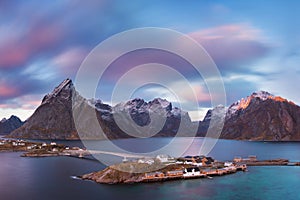 Panoramic landscape, winter mountains and fjord reflection in water. Norway, the Lofoten Islands.