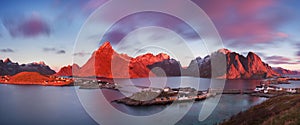 Panoramic landscape, winter mountains and fjord reflection in water. Norway, the Lofoten Islands.