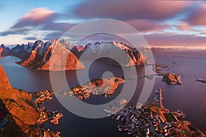 Panoramic landscape, winter mountains and fjord reflection in water. Norway, the Lofoten Islands.