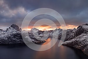 Panoramic landscape, winter mountains and fjord reflection in water. Norway, the Lofoten Islands.