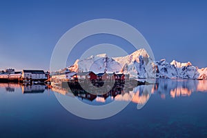 Panoramic landscape, winter mountains and fjord reflection in water. Norway, the Lofoten Islands.