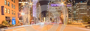 Panoramic light trails and office buildings at North LaSalle Street bridge in downtown Chicago at night