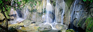 Panoramic mature trees and milky falls at Thac Voi waterfall, Thanh Hoa, Vietnam