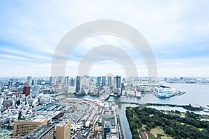 Panoramic modern city skyline bird eye aerial view of Odaiba bay and bridge under dramatic sunrise and morning blue cloudy sky in