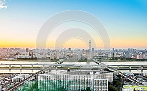 Panoramic modern city skyline bird eye aerial view with tokyo skytree under dramatic sunset glow and beautiful cloudy sky in Tokyo