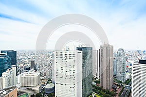 Panoramic modern city skyline bird eye aerial view under dramatic sun and morning blue cloudy sky in Tokyo, Japan