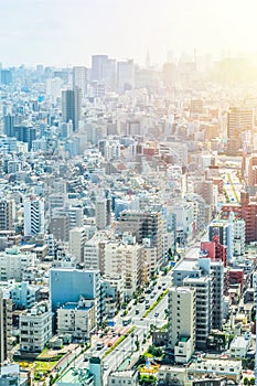 Panoramic modern city urban skyline bird eye aerial view under sun & blue sky in Tokyo, Japan