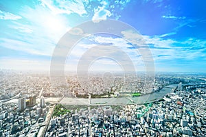 Panoramic modern city urban skyline bird eye aerial view under sun & blue sky in Tokyo, Japan