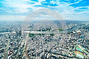 Panoramic modern city urban skyline bird eye aerial view under sun & blue sky in Tokyo, Japan