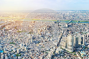 Panoramic modern city urban skyline bird eye aerial view under sun & blue sky in Tokyo, Japan