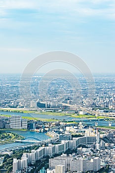 Panoramic modern city urban skyline bird eye aerial view under sun & blue sky in Tokyo, Japan