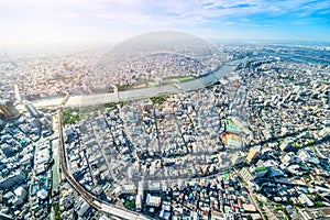 Panoramic modern city urban skyline bird eye aerial view under sun & blue sky in Tokyo, Japan