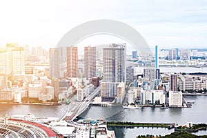 Panoramic modern cityscape building bird eye aerial view of Odaiba bay and rainbow bridge under sunrise and morning blue bright sk