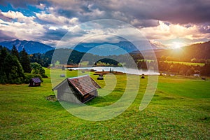 Panoramic morning scene of Wagenbruchsee (Geroldsee) lake with Zugspitze mountain range on background. Amazing autumn view of