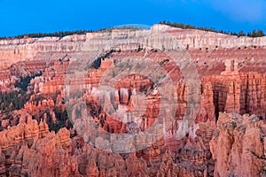 Panoramic morning sunrise view on sandstone rock formations on Navajo Rim hiking trail in Bryce Canyon National Park, Utah