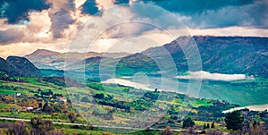 Panoramic morning view of Rosamarina lake. Dramatic sammer sunset in Sicily, Caccamo village location, Italy, Europe. Beauty of na