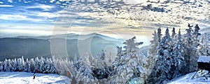 Panoramic mountain view of beautiful mountain peaks at snow day on the top of Stowe Mountain Ski resort