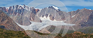 Panoramic mountain view. Rocky peaks, glaciers, treeless photo