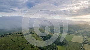 Panoramic nature hills landscape with a low clou coming