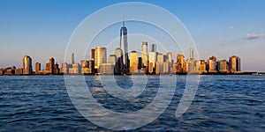 Panoramic of New York City Financial District skyscrapers at sunset