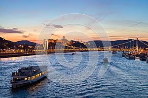 Cruise boat passing Elisabeth bridge at Budapest, night view