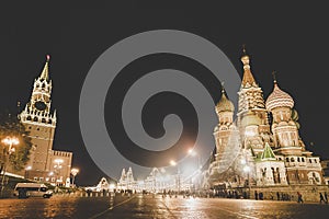 Panoramic night view of Spasskaya Tower of the Kremlin and St\' Basil Cathedral in Red Square, Moscow, Russian Federation. Red