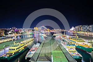 Panoramic night view of Sydney Harbour bridge circular quay ferry terminal opera house and City Skyline of of Sydney Australia