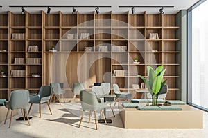 Panoramic office area in beige and green with shelving and seating