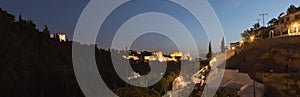 Panoramic photo of the Alhambra at night.