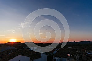 Panoramic photo of a beautiful sunrise in a small Spanish village