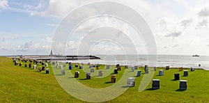 Panoramic photo of the coast of Cuxhaven Lower Saxony, Germany. Beach baskets on the North Sea