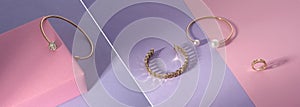 Panoramic photo collage of golden jewelry on pink and purple background