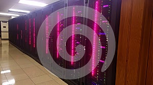 Panoramic photo of a huge server room with arrays of servers, creating an impressive technologi