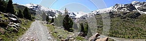 Panoramic photo of mountain landscape in the Forni Valley, path