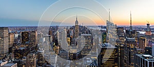 Panoramic photo of New York City Skyline in Manhattan downtown with Empire State Building and skyscrapers at night USA photo