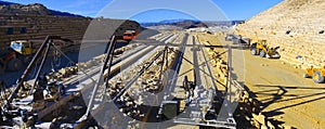 Panoramic photo. Production machines and equipment in quarry for