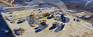 Panoramic photo. Production machines and equipment in quarry for