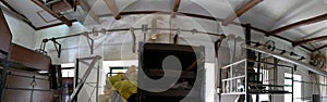 Panoramic photo of the pulley and rod production machine of the Cha Gorreana tea factory in Sao Bras in Azores