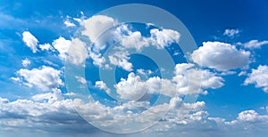 Panoramic photo of white cumulus clouds in the blue sky background