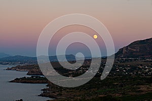 Panoramic picture with moon. Sunset on the paradise Mediterranean sea bay near Scopello