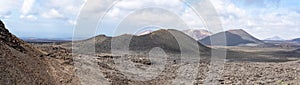 Panoramic picture of the various volcano craters in the national park Parque Nacional de Timanfaya, Lanzarote, Spain photo