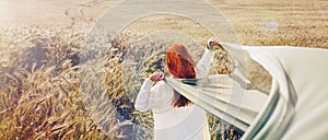 Panoramic picture of walking red hair woman by the plain field