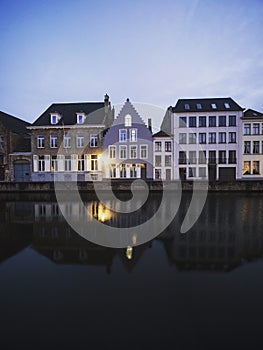 Panoramic reflection view of river canal channel in historic city center Bruges West Flanders Flemish Belgium Europe