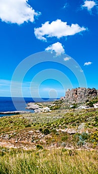 Panoramic road to drive over the Mediterranean sea with clouds against a clear blue sky