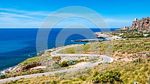 Panoramic road to drive over the Mediterranean sea. Wild coastline with rocks and sandy beaches, against a deep blue sea at San V photo