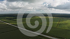 Panoramic rotation over fields and rural roads aerial view