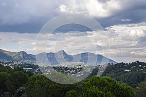 Panoramic rural landscape of hills with the Maritime Alps mountains in the distance near the village Saint-Paul-de-Vence, France